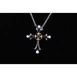 The Midnight Sapphire 14K Cross by Igor Carl Faberge, an enamel and gem-set cross pendant,