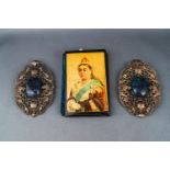 An Edwardian filigree and glass inset two piece buckle, each part pierced and embossed with flowers,