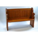 A 20th century pitch pine church pew,