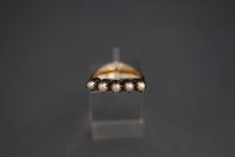 A five stone pearl ring, stamped '14ct', the pearls (untested and unwarranted) of approximately 3.