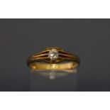 An early 20th century 18ct gold and diamond solitaire gypsy ring, the old-cut stone approx. 0.