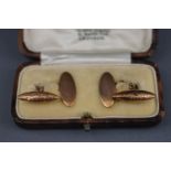 A pair of early 20th century gold cuff links,
