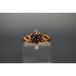 A 9ct gold and small sapphire nine stone cluster ring, Birmingham 1973, size N, 2.