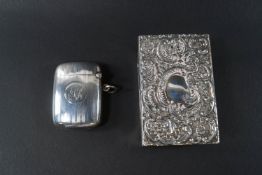 A silver vesta/match case with engine turned bands,