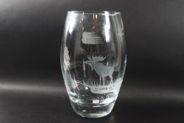 A Swedish glass vase etched with a stag and trees, signed Bergdala to base,