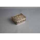 A modern silver rectangular pill box,