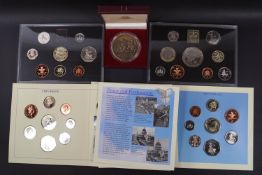 Three coin proof sets, two un-circulated coin sets,