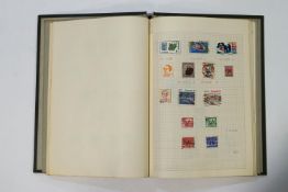 Two World stamp albums, including Commemorative,