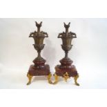 A pair of 19th century spelter candlesticks modelled as flower filled urns,