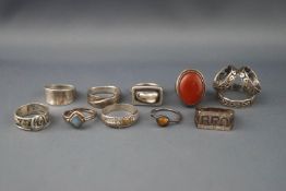 Ten various silver or white metal rings including an oval cabochon carnelian ring,