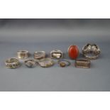 Ten various silver or white metal rings including an oval cabochon carnelian ring,