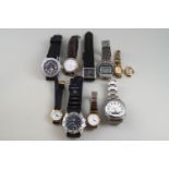 A miscellaneous collection of lady’s and gentleman’s wrist watches,