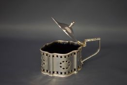 An Irish silver shaped oval mustard pot with pierced sides, a domed cover with knop finial,