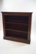An early 20th century oak bookcase having three shelves,