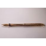 An early 20th century rose gold combined propelling pen & pencil,