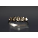 An early 20th century platinum and diamond five stone ring, the graduated old-cut stones approx. 1.