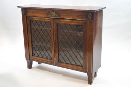 A Regency style rosewood side cabinet with brass inlay and mounts,