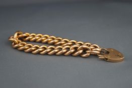 An early 20th century rose gold hollow curb bracelet, apparently unmarked,