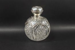 A silver mounted clear cut glass spherical scent bottle,