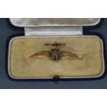 An early 20th century gold and enamel RAF 'Wings' brooch, stamped '9ct', later steel pin, 40mm wide,