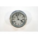 A chromed bulkhead clock by R Barrett of Ipswich, 20cm diameter at widest point,