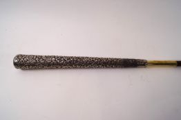 A slim ladies cane with 10" Indian silver handle