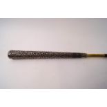 A slim ladies cane with 10" Indian silver handle