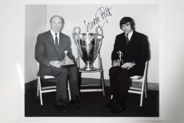 A signed photograph of George Best,