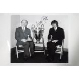 A signed photograph of George Best,