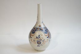 A Doulton Lambeth 'Carrara' bottle vase, hand painted with blue and terracotta Classical decoration,