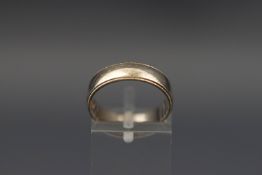 A 9ct white gold wedding ring, London 1985, size M, 3.2 grams.