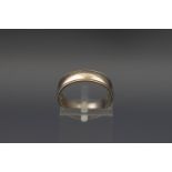 A 9ct white gold wedding ring, London 1985, size M, 3.2 grams.