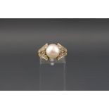 A cultured freshwater bouton pearl and diamond ring,