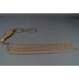 An early 20th century rose gold fetter-and-three guard chain with a swivel clasp,
