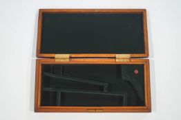 A Colt revolver case with key, 38cm wide x 17.