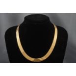 An Italian 9 carat gold collet necklace, of broad herringbone links on a lobster claw clasp,
