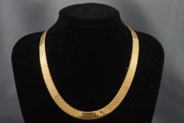 An Italian 9 carat gold collet necklace, of broad herringbone links on a lobster claw clasp,