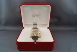 Cartier, Santos de Cartier, a mid size stainless steel an gilt bracelet watch, circa 2002,