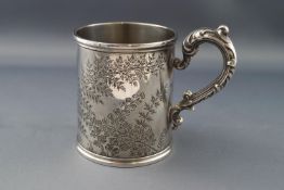 A Victorian silver christening mug, with scroll handle,