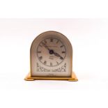 An early-mid 20th century brass eight day desk clock by Davall, retailed by Murgatroyd & Horsfall,