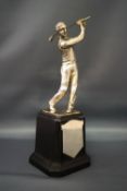 A plated golf trophy, in the form of a figure with golf club in hand, stamped, "1934 Art Metalwork,