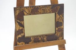A Japanese style wall mirror with carved wood waterlilies to the frame, 46.