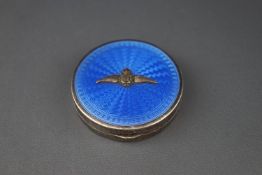 A silver and pale blue guilloche enamel round compact applied with the R.A.F.