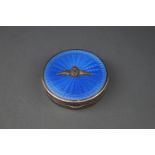 A silver and pale blue guilloche enamel round compact applied with the R.A.F.