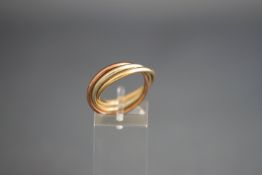 A 9ct tri-colour gold 'Russian' wedding band, in white rose and yellow gold, marks obscured, size N,