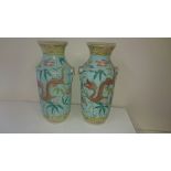 A pair of 19thC Chinese porcelain dragon vases with pale turquoise grounds, yellow borders, 8” - a/