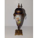 A 19thC Vienna style ormolu mounted porcelain urn of slender proportions, painted with a scene