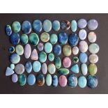 55 various small Ruskin cabochon plaques – mainly oval.