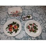 An Esther Weeks Exon Wemyss floral painted shaped rectangular dish, two fruit plates and a small