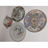 An early 19thC Chinese famille rose blue ground porcelain plate, decorated with panels of birds,